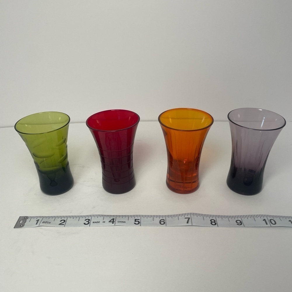 Vintage patterned multicolored shooter glasses.